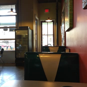 Cafe 212 - a table with a cup of coffee and a plate of food - Coffee & Tea Near Me - Tupelo, Mississippi