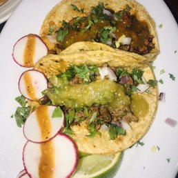Steak and Al Pastor (pork) Taco with a side of mexican style rice and homemade salsa (organic) Steak and Al Pastor (pork) Taco with a side of mexican style rice and homemade salsa (organic)