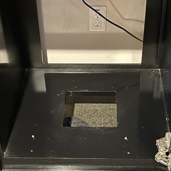 Hotel Royal Oak - Old socks in empty cupboard where a fridge may have once been - Hotels Near Me - Royal Oak, Michigan