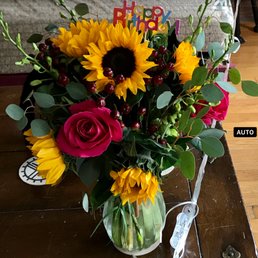 Sun Flowers large arrangement with winter fill-in. Balloons attached. Sun Flowers large arrangement with winter fill-in. Balloons attached.