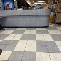 Super Wok - Front counter area  . Floor is extremely dirty !