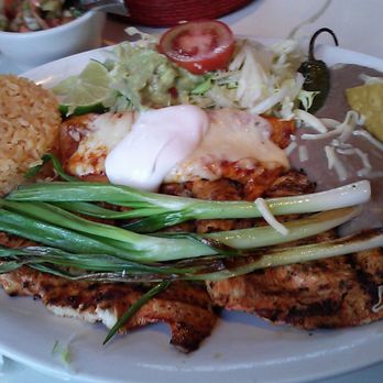 Pancho Pistolas - Pollo a la Tampiquena. Chicken was perfectly seasoned and grilled. Meal includes a cheese enchilada, rice and beans. - Mexican Near Me - Chicago, Illinois