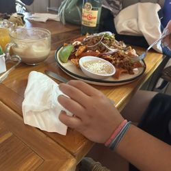 Buzos Del Cabo - Easy does it!!! Chilaquiles with beans and meat is a large portion. Better be hungry!!