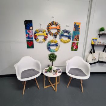 Delish - two chairs and a table in a room - Convenience Stores Near Me - Arden, North Carolina