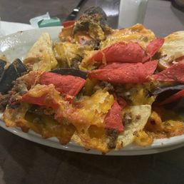 Cheese nachos with beef added for an extra 3.00