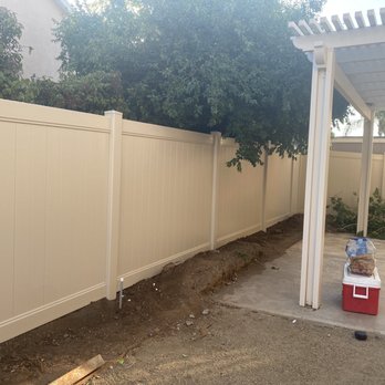 Marquez Fencing - This is the off white color . Don't mind the dirt piles we're redoing our planters now that we have a new fence . - Fences & Gates Near Me