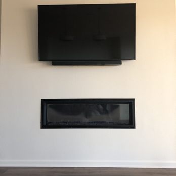 TheTvHangman - TV mount over fireplace - Home Theatre Installation Near Me
