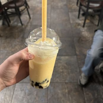 Little Saigon Cafe - a hand holding a cup of bubble tea - Vietnamese Near Me - Orange Park, Florida Little Saigon Cafe - a hand holding a cup of bubble tea - Vietnamese Near Me - Orange Park, Florida