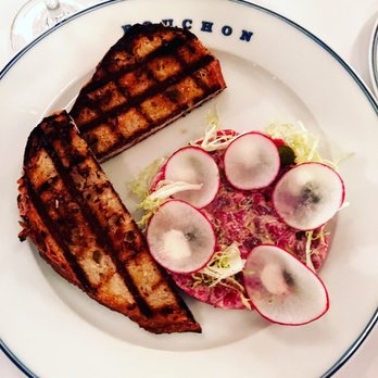 Bouchon - Tartare de Boeuf* beef tartare with radishes, cornichons, frisée & horseradish crème fraîche, served with grilled pain de campagne - French Near Me - Las Vegas, Nevada