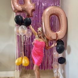 Birthday girl with her slightly deflated balloons (this photo was taken 1 week after delivery)