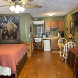 The Mountain Lodge Room with 1 Queen bed, 2 leather rocker Recliners, Kitchenette, & private bathroom with tub/shower.