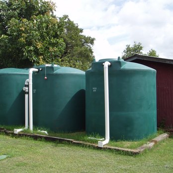 Innovative Water Solutions - Hybrid rainwater harvesting and well water storage system with three 2,500 gallon polyethylene cisterns - Landscaping Near Me - Austin, Texas