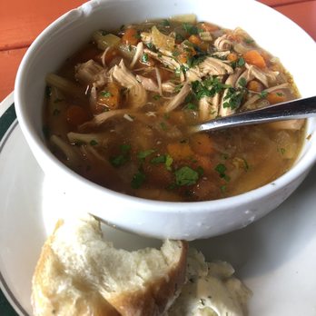 Campfire Grill - This is the most amazing chicken soup I've ever had in my life. And look at the garlic butter and the roll. Freakin delish! OMG!! - Bars Near Me - Flat Rock, North Carolina