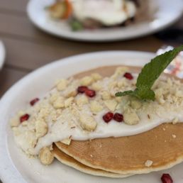 Island Style Pancakes {5/5}: fluffy goodness topped with flavorful coconut syrup, Mac nuts, and a touch of pomegranate seeds