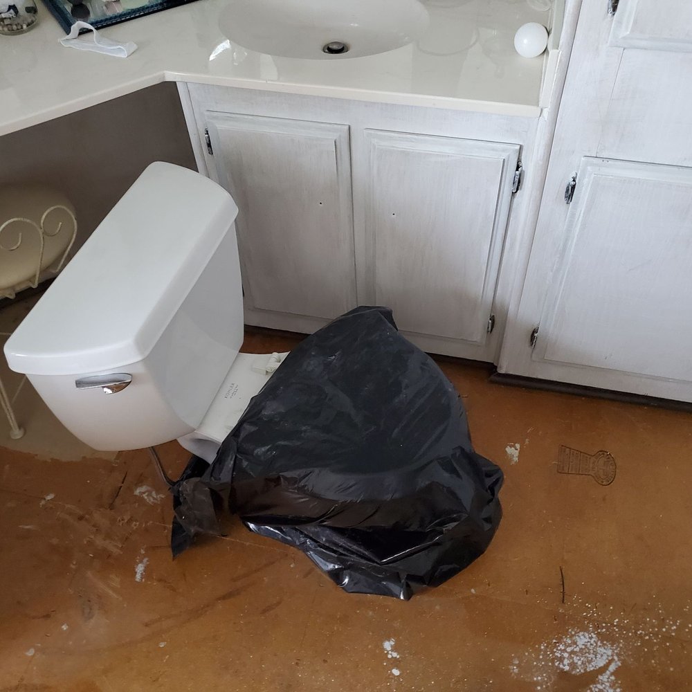 Toilet left sitting off to the other side. Toilet left sitting off to the other side.