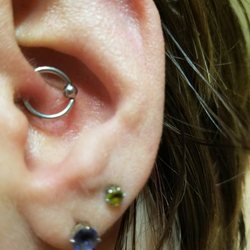 Idle Hands Tattoo & Piercing - Nicely healed daith piercing for headache relief.
