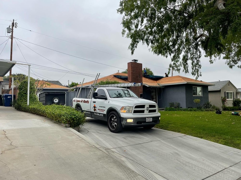 Slide of New Village Roofing