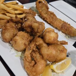 1 Fish filet (in the back) and the Trio: shrimp,  scallops,  and oysters (front). Fried to perfection.