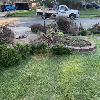 Ultimate Landscaping & Tree Services - a truck parked in front of a house - Landscaping Near Me Ultimate Landscaping & Tree Services - a truck parked in front of a house - Landscaping Near Me