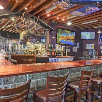 Joe Daniel's - a bar with wooden bar stools - Pubs Near Me - Palos Heights, Illinois