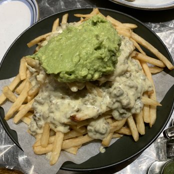 El Chingon - still in a food coma. This was amazing! Popotas with their own sauce, chorizo, and topped withhomemade guacamole - Sandwiches Near Me - Philadelphia, Pennsylvania