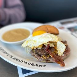 Grumpy's Restaurant - OP Sunrise Breakfast Burger. Sunny side up egg with super drip ! Applesauce side. Food coma!