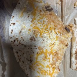 Supposed to be a steak quesadilla there's literally two pieces of steak on here and cheese isn't even melted Supposed to be a steak quesadilla there's literally two pieces of steak on here and cheese isn't even melted