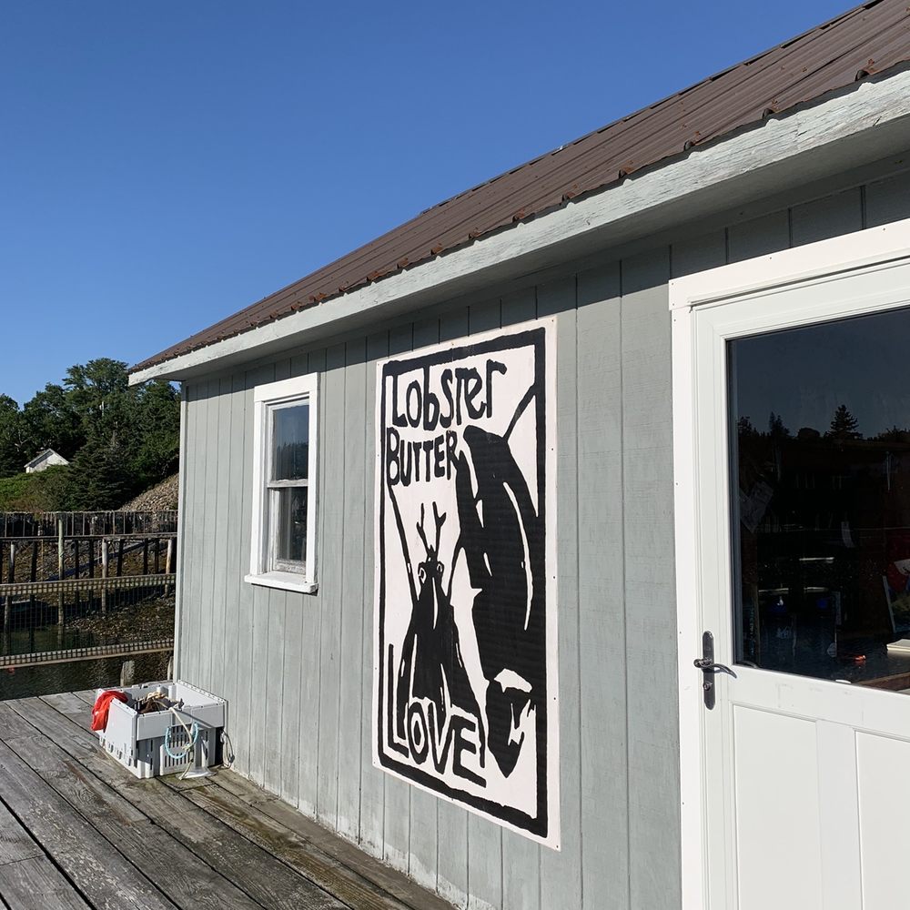 Lunt's Dockside Deli - a sign on the side of a building - Seafood Near Me - Frenchboro, Maine