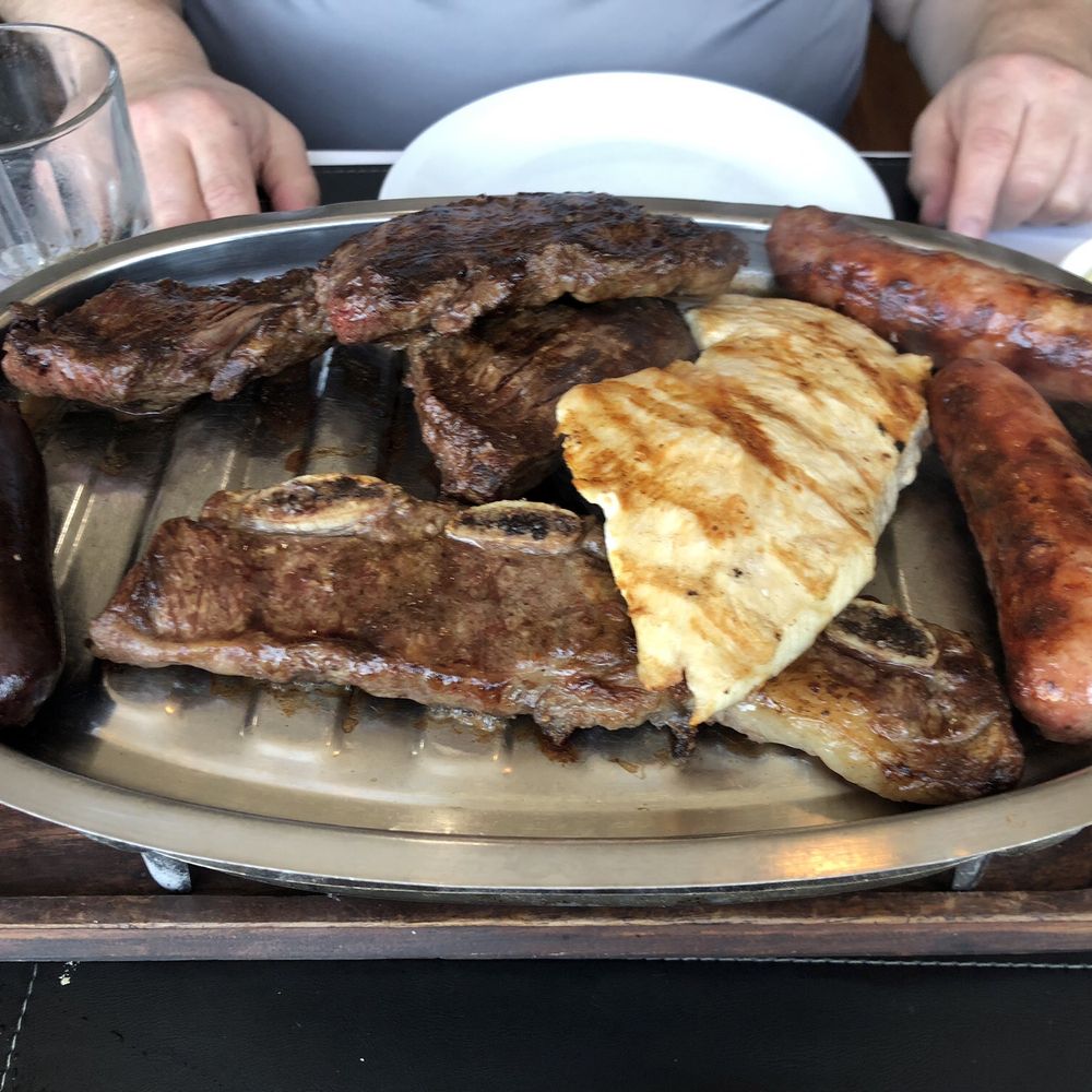 Patagonia - Beef rib, chicken breast, Argentinean sausage, entraña and blood sausage. - Argentine Near Me - Royal Palm Beach, Florida Patagonia - Beef rib, chicken breast, Argentinean sausage, entraña and blood sausage. - Argentine Near Me - Royal Palm Beach, Florida