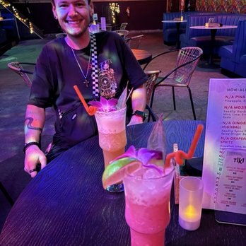 The Tiki Easy Bar - Husband and some delicious drinks - Cocktail Bars Near Me - Asheville, North Carolina