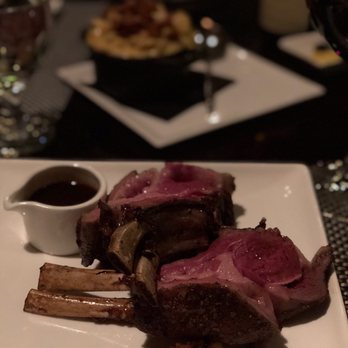 Six Peaks Grille - Lamb rack with mac and cheese in the back - Steakhouses Near Me - Olympic Valley, California Six Peaks Grille - Lamb rack with mac and cheese in the back - Steakhouses Near Me - Olympic Valley, California