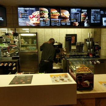 McDonald's - a man working behind the counter - Burgers Near Me - Daphne, Alabama McDonald's - a man working behind the counter - Burgers Near Me - Daphne, Alabama