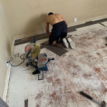 Torres Flooring - a man working on the floor - Flooring Near Me Torres Flooring - a man working on the floor - Flooring Near Me