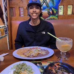 Enchiladas and steak fajitas and margarita