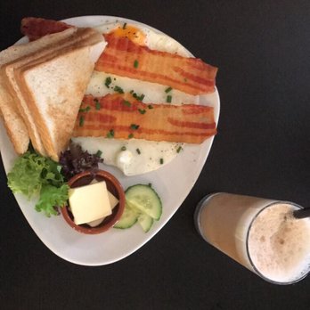 Café Mütlich - 2 fried eggs, toast, and bacon with an Iced Latte - Cafes Near Me - Berlin, BE Café Mütlich - 2 fried eggs, toast, and bacon with an Iced Latte - Cafes Near Me - Berlin, BE