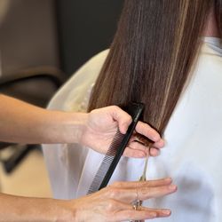 Molly Moon Salon - Molly cutting a clients hair!