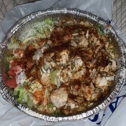 a chicken salad in a foil container