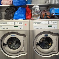 Wash Place - Two of the five medium industrial sized washing machines.