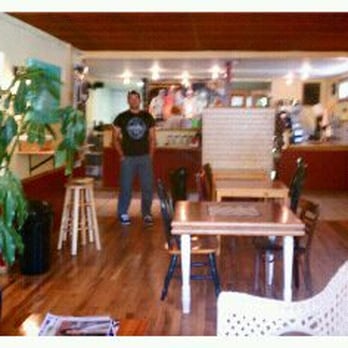 Mugby Junction - a man standing in a coffee shop - Coffee & Tea Near Me - Winona, Minnesota