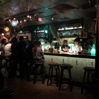 Lei Low - The vibrant, colourful tiki bar, adorned with pineapple lamps, palm tree roofing, traditional island fish basket, and more! - Cocktail Bars Near Me - Houston, Texas