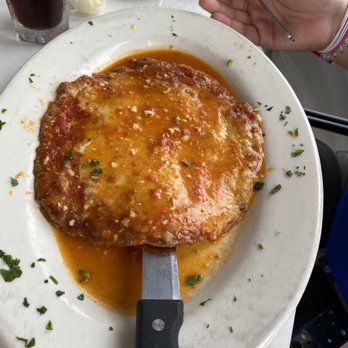 La Dolce Vita - Veal Parmesan, huge look at the size compared to the hand - Italian Near Me - Plainfield, Illinois