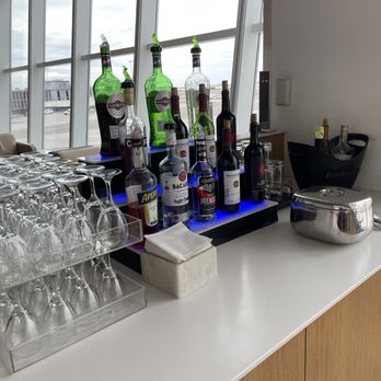 Lufthansa Senator Lounge - a bar with a lot of bottles and glasses - Airport Lounges Near Me - Jamaica, New York Lufthansa Senator Lounge - a bar with a lot of bottles and glasses - Airport Lounges Near Me - Jamaica, New York