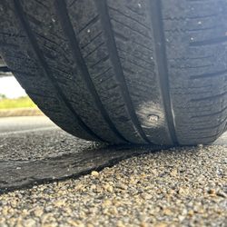 Palacio Tire and Muffler Shop - The screw that was in my tire front passenger.