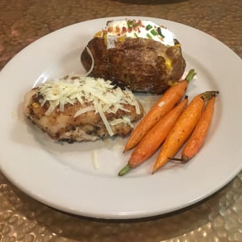 Copper Creek Restaurant - Abilene - Stuffed chicken, roasted carrots, and a baked potato. - Steakhouses Near Me - Abilene, Texas