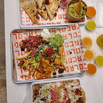 Tacolada - Carne Asada Quesadilla, Surf N' Turf Fries, Baja Shrimp Taco and Baja Fish Taco - Mexican Near Me - Austin, Texas Tacolada - Carne Asada Quesadilla, Surf N' Turf Fries, Baja Shrimp Taco and Baja Fish Taco - Mexican Near Me - Austin, Texas