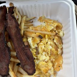 Burnt eggs, cold fries and bacon Burnt eggs, cold fries and bacon