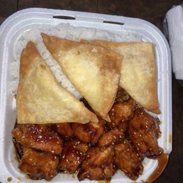 Sesame Chicken and white rice and crab rangoons Sesame Chicken and white rice and crab rangoons