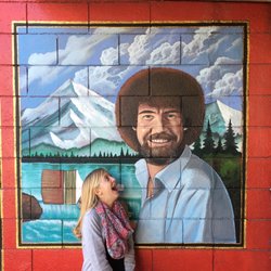Desert Art Supplies - The Joy of Posing, out front with Bob Ross! Happy little b-day girl!