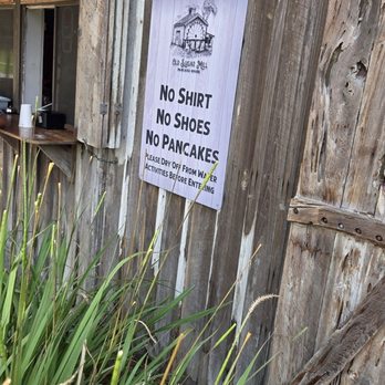 Old Sugar Mill Pancake House - A sign that says,  "No shirt,  no shoes,  no pancakes" - American Near Me - De Leon Springs, Florida