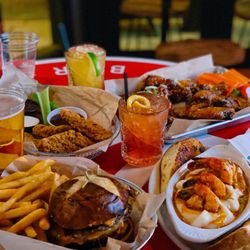 Over/Under Sports Bar - Montana Burger Sautéed shrimp Wings and tenders